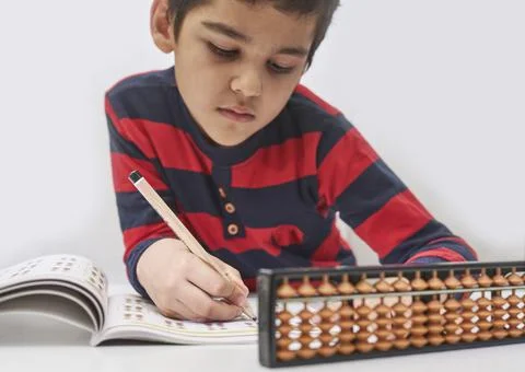A schoolboy do mental math Stock Photos