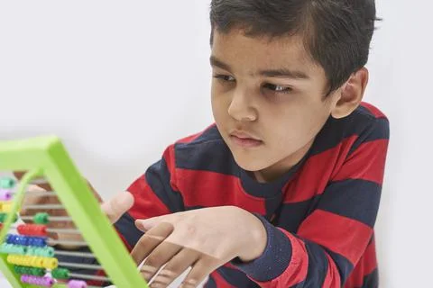 A schoolboy do mental math Stock Photos
