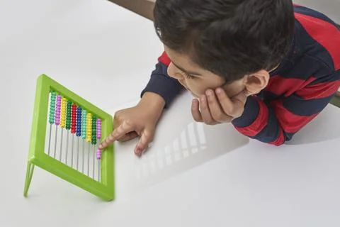 A schoolboy do mental math Stock Photos
