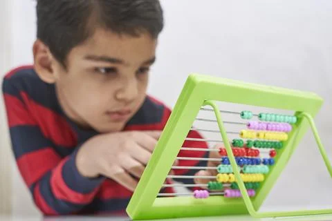 A schoolboy do mental math Stock Photos