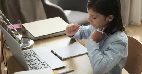 Schoolboy Doing Homework at the Desk with Notebook Video stock 254501874