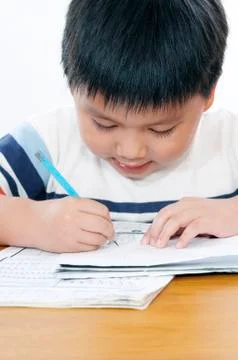 Schoolboy doing homework Stock Photos