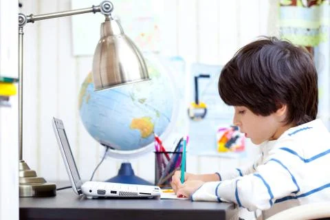 Schoolboy doing homework Foto stock