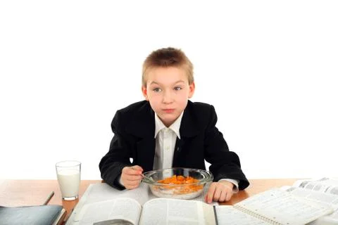 Schoolboy eats Stock Photos