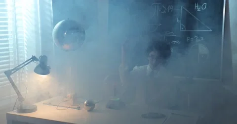 Schoolboy experimenting in physics class. Young student doing physics experiment Stock Footage 172442349