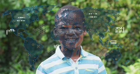 Schoolboy facing camera, world map fading in and layering network nodes over Stock Footage 329812697