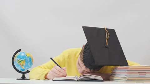 Schoolboy fallen asleep on book while studying late in the evening Video stock 172488360