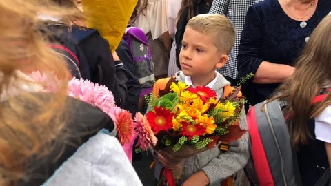 Schoolboy - first-grader with a large beautiful bouquet of flowers Stock Footage 116184945