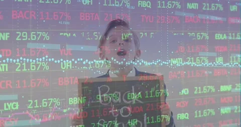 A schoolboy holding a chalkboard with the text back to school Stock Footage 330254742