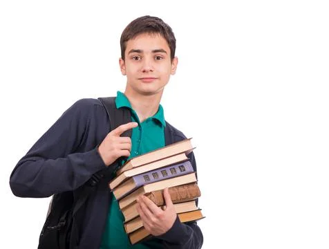 Schoolboy holding a stack of books, textbook isolated on white background . C Stock Photos