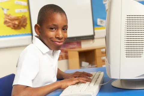 Schoolboy In IT Class Using Computer 스톡 사진