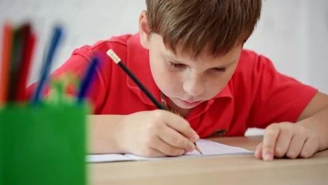 The schoolboy learns to write Stock Footage 92035607