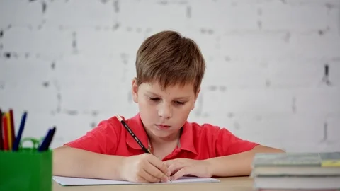 The schoolboy learns to write Stock Footage 92037280