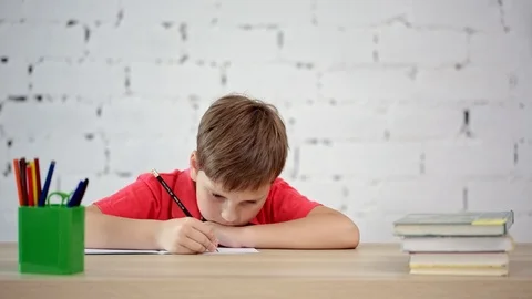 The schoolboy learns to write Stock Footage 92037455
