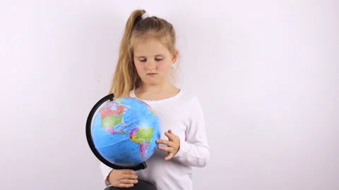 Schoolboy looks at the globe. Distance learning at the time of a pandemic. Stock Footage 140774838