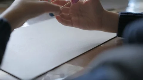 Schoolboy models the geometric shapes from plasticine and matches. Stock Footage 128988930
