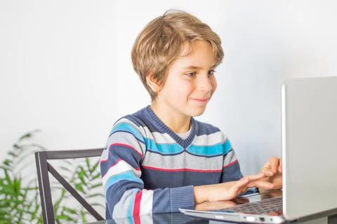 A schoolboy for online learning in front of computer Stock Photos