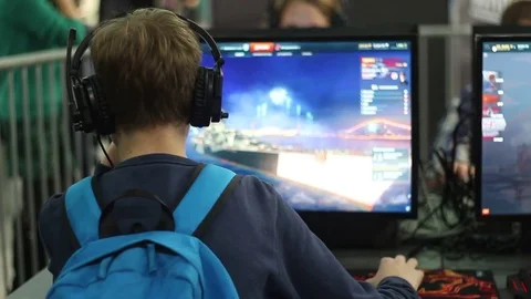 Schoolboy playing a computer game Stock Footage 72821823