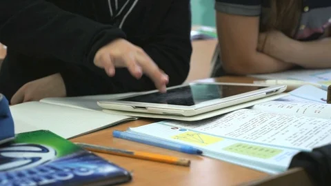 Schoolboy plays in games using computer tablet Stock Footage