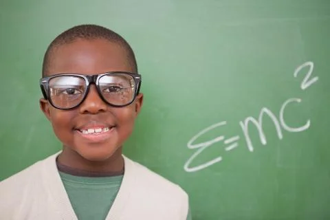 Schoolboy posing with the the mass-energy equivalence formula Stock Photos