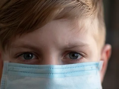 Schoolboy with protective mask. Stock Photos