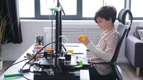 Schoolboy Prototyping Cogwheel For 3D Printer Stock Footage 266788838