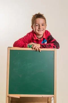Schoolboy with school board Stock Photos
