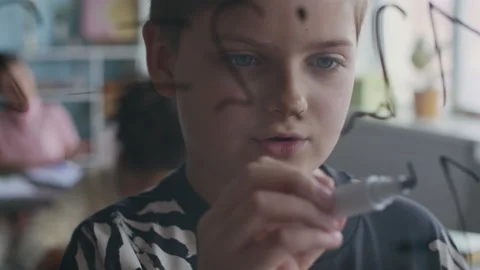 Schoolboy Solving Math Problem at Transparent Board During Lesson Stock Footage 312049550