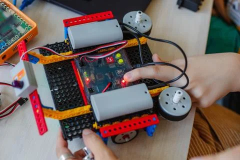 Schoolboy study in a robotics class, assemble a robot constructor. 스톡 사진