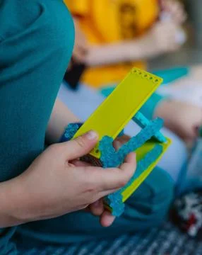 Schoolboy study in a robotics class, assemble a robot constructor. Stock Photos