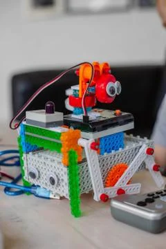 Schoolboy study in a robotics class, assemble a robot constructor. Stock Photos