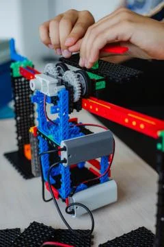 Schoolboy study in a robotics class, assemble a robot constructor. 스톡 사진