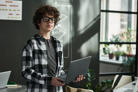 Schoolboy studying IT technology at class Stock Photos
