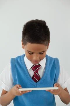 Schoolboy using digital tablet 스톡 사진