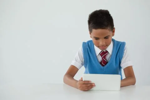 Schoolboy using digital tablet Foto stock