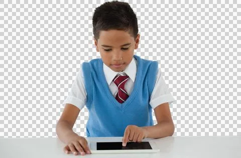 Schoolboy using digital tablet at table Illustrazione stock