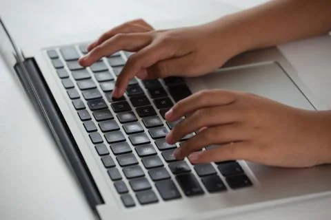 Schoolboy using laptop Foto stock