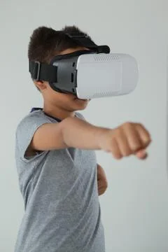 Schoolboy using virtual reality headset Foto stock