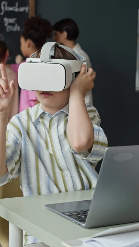Schoolboy Using Vr Headset and Typing on Laptop in Classroom Stock Footage 339198779