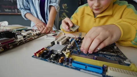 Schoolboys Assembling Motherboard in Computer Science Class Stock Footage 340552520