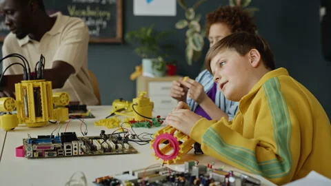 Schoolboys Assembling Robotic Toy during Stem Education Class Stock Footage 340551106