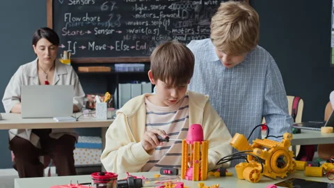 Schoolboys Constructing Robot during Stem Education Class Stock Footage 339202270