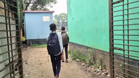Schoolboys Entering High School Through Gate With Backpacks Stock Footage 337389387