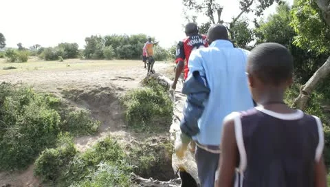 Schoolboys Pass Over Fallen Log Stock Footage 10721630