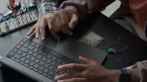 Schoolboys Using Laptop while Preparing Electronics Project in Class Stock Footage 284437076