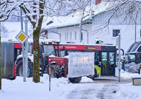  A schoolbus is blocked while farmers demonstrate for diesel subsidies and... Stock Photos