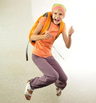 Schoolchild with backpack jumping Stock Photos
