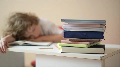 Schoolchild do homework. The boy does his homework at home. pupil has been bored Stock Footage 64141969