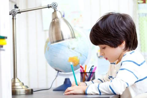Schoolchild doing homework Stock Photos