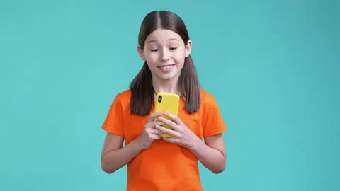 Schoolchild use gadget read like post comment isolated cyan color background Stock Footage 190180568
